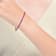 Ruby Color CZ Tennis Bracelet In 14K Gold Over Brass