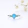 Pear Shape Lab Created Blue Opal and Round Green Nanocrystal Sterling
Silver Opal Ring 3-Stone Ring
