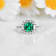 Green Lab Created Emerald and Moissanite Rhodium Over Sterling Silver
Halo Design Ring