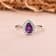 Pear Shape Amethyst with Moissanite Accents Rhodium Over Sterling Silver
Halo Ring