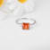 Peach Orange Lab Created Padparadscha Sapphire Rhodium Over Sterling
Silver Three Stone Ring