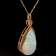 Ethiopian Opal Pear Shape Cabochon and Round Diamond 14K Yellow Gold
Pendant with Chain, 17.48ctw