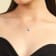 Blue Sapphire and Moissanite Sterling Silver Halo Style Pendant With Chain