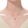 CZ Snail Charm Station Necklace In 14K Gold Over Brass