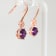Amethyst and CZ 1.59 Ctw Round 18K Rose Gold Over Sterling Silver Drop
Earrings Jewelry.