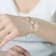 Two-Tone Halo Station Bracelet In Sterling Silver And 18K Rose Gold Over
Sterling Silver