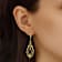 Black Teardrop Dangle Earrings In Gold Tone