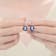 Sapphire Color CZ Halo Drop Earrings In Sterling Silver