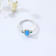 Pear Shape Lab Created Blue Opal and Round Green Nanocrystal Sterling
Silver Opal Ring 3-Stone Ring