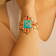Barse Jewelry Composite Turquoise With Opal & Coral Gold Tone Santa
Fe Cross Cuff Bracelet