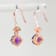 Amethyst and CZ 1.59 Ctw Round 18K Rose Gold Over Sterling Silver Drop
Earrings Jewelry.