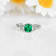 Green Lab Created Emerald and Moissanite Rhodium Over Sterling Silver
Center Design Ring