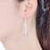 Pave CZ Linear Drop Earrings In 18K Rose Gold Over Sterling Silver