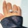Freshwater Pearl and Moissanite Rhodium Over Sterling Silver Halo Flower
Design Ring