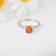 Peach Orange Lab Created Padparadscha Sapphire Round Rhodium Over
Sterling Silver Solitaire Ring