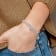 Rhodium Over 14K White Gold Lab Grown Diamond Swirl Bangle 0.992ctw