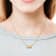 1/2 CT TGW Created White Sapphire Scroll Pendant with Chain in Yellow
Plated Sterling Silver