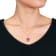 8 3/8 CT TGW Pink Topaz and White Sapphire Halo Pendant with Chain in
Yellow Plated Sterling Silver