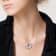 2 CT TGW African Amethyst and White Topaz Flower Pendant with Chain in
Sterling Silver