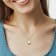 1 3/8 CT TGW Opal White Topaz and Diamond Accent Pendant With Chain in
Yellow Plated Sterling Silver