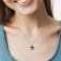 2 1/7 CT TGW Garnet, White Topaz and Diamond Pendant with Chain in
Yellow Plated Sterling Silver