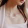 6-7.5MM Freshwater Cultured Pearl and 1/5 CT TGW Topaz Bar Necklace in
Sterling Silver