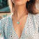 1/10 CT TGW White Topaz with Light Blue Enamel Flower Pendant with Chain
in Sterling Silver