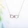 1/10 CT TW Diamond Infinity Heart Necklace in 2-Tone Pink and White
Sterling Silver