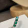 Lovely Emerald ring with 1.50 cts in 5 round shape, crafted in 14K white gold.