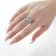 Beverley K 18K White Gold 0.35ctw Diamond and 0.76ctw Sapphire Ring set
with a 1.15ct Opal Center