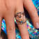 Sterling Silver Fishing Hook Heart Open Design Ring with Blue CZ Accent.
