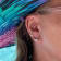 Sterling Silver Wave Stud Earrings with Blue CZ Accents.