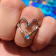 Sterling Silver Fishing Hook Heart Ring with Rope Design and Blue CZ Accent.