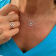 Sterling Silver Compass Rolo Chain Necklace with Crystal and Blue CZ Accents.