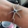 Sterling Silver Starfish Bangle Bracelet with Blue CZ Center.