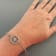 Sterling Silver Compass Rolo Chain Bracelet with Blue CZ Accent.