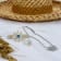 Sterling Silver Sun Necklace with Rolo Chain and Blue CZ Center.