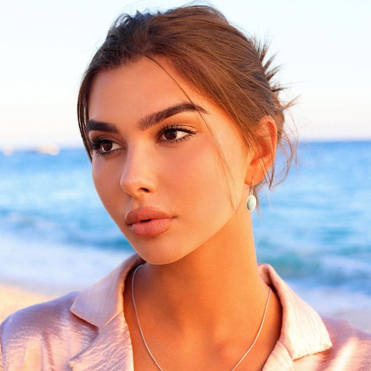 Oval Larimar and Cubic Zirconia Halo Rhodium Over Sterling Silver
Fishhook Earring