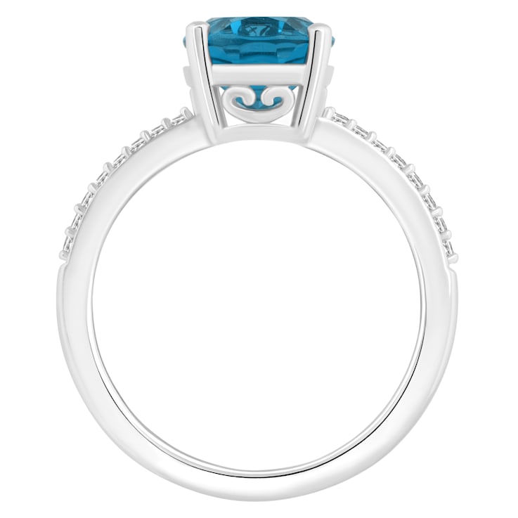 10x8mm Oval London Blue Topaz and 1/10 ctw Diamond Rhodium Over Sterling
Silver Ring