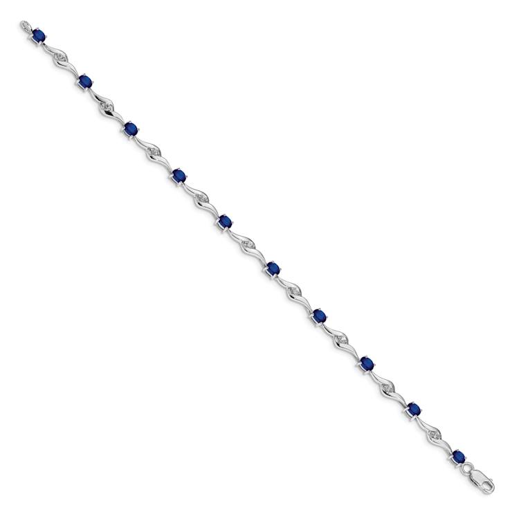 Rhodium Over 10k White Gold Oval Shaped Blue and Round Shaped White
Sapphire Bracelet