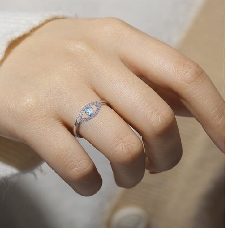 Blue Topaz with Moissanite Accents Rhodium Over Sterling Silver Evil Eye
Halo Ring
