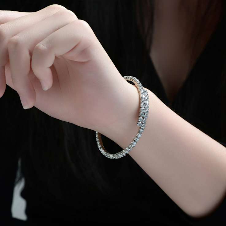 Bypass CZ Tennis Bracelet In White Rhodium Over Brass
