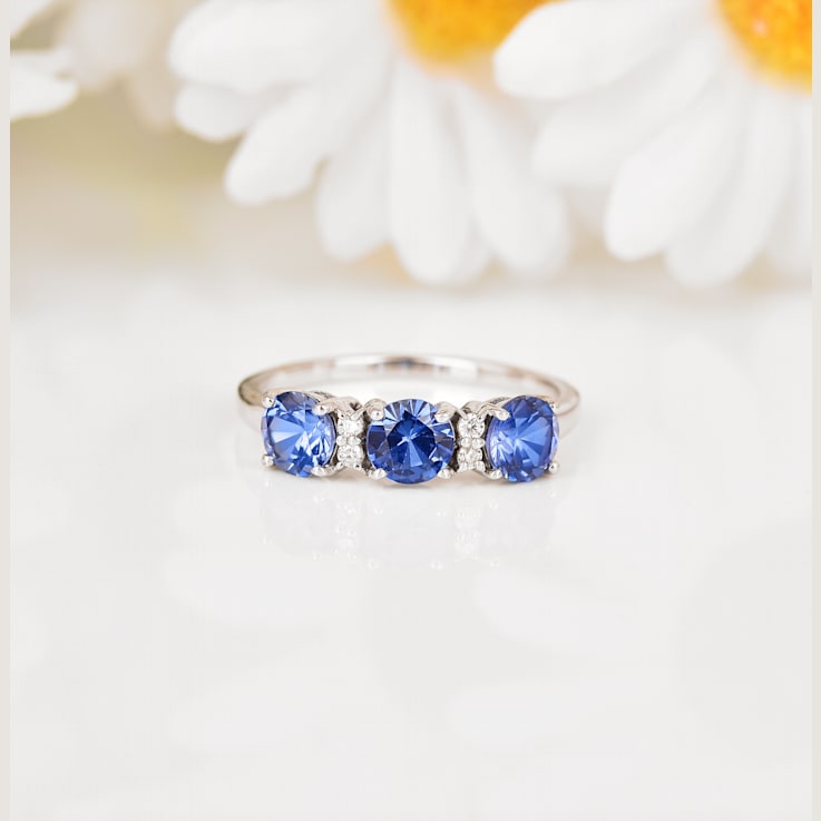 Blue Sapphire and Moissanite 3-Stone RingRhodium Over Sterling Silver
Round Lab Created