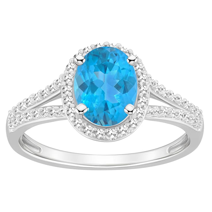 8x6mm Oval Blue Topaz 1/4 ctw Diamond Rhodium Over Sterling Silver Halo Ring
