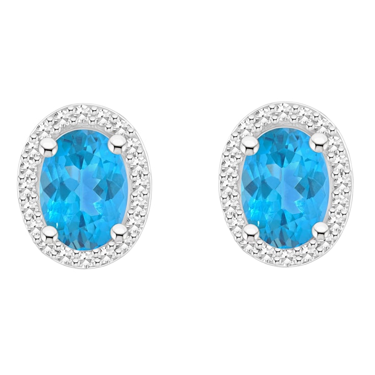 7x5mm Oval Blue Topaz 1/5 ctw Diamond Rhodium Over Sterling Silver Halo
Stud Earrings
