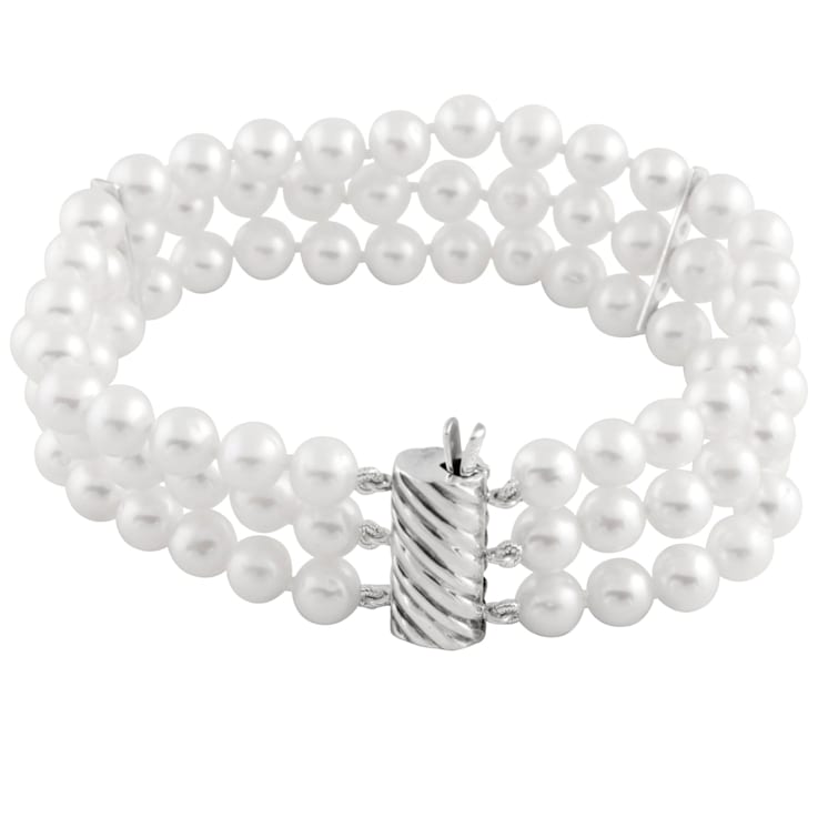 White 5-6mm triple row freshwater pearl bracelet with a sterling silver
clasp, 7"
