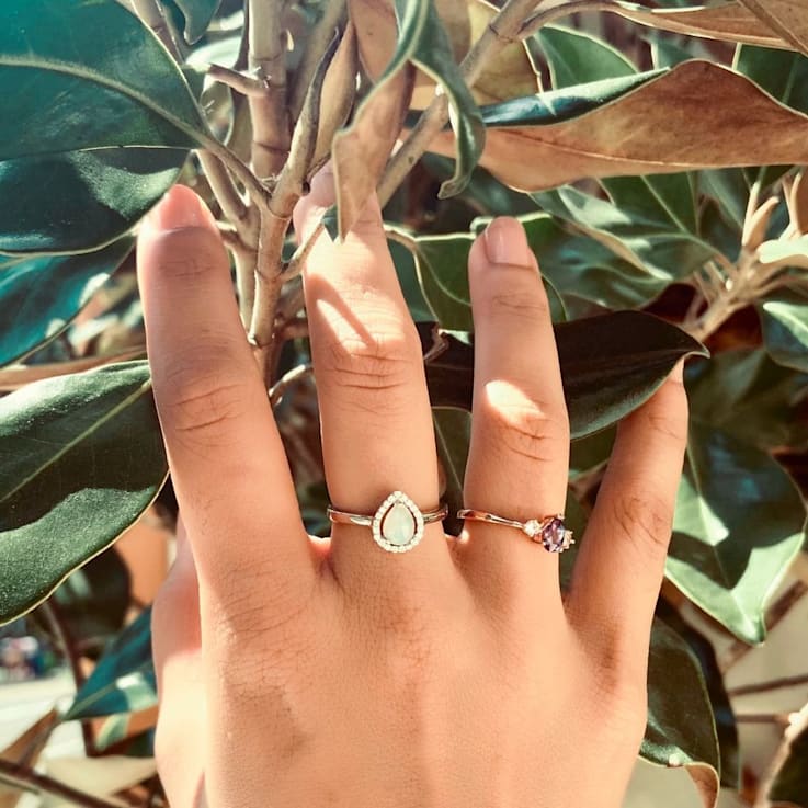 Pear Shape Lab Created Opal with Moissanite Accents Rhodium Over
Sterling Silver Halo Ring