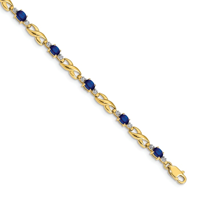 14k Yellow Gold and Rhodium Over 14k Yellow Gold Diamond and Oval
Sapphire Bracelet