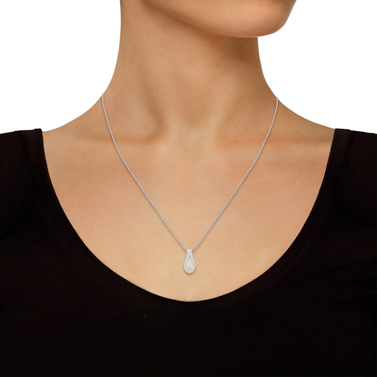 6x4mm Oval Opal 1/8 ctw Diamond Rhodium Over Sterling Silver Halo
Pendant with Chain