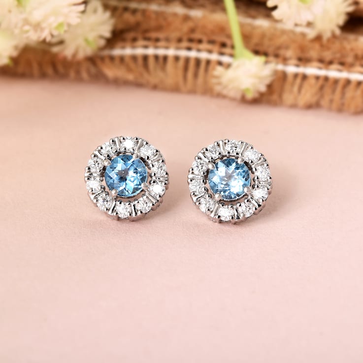 Round Blue Topaz with Moissanite Accents Rhodium Over Sterling Silver
Halo Earrings